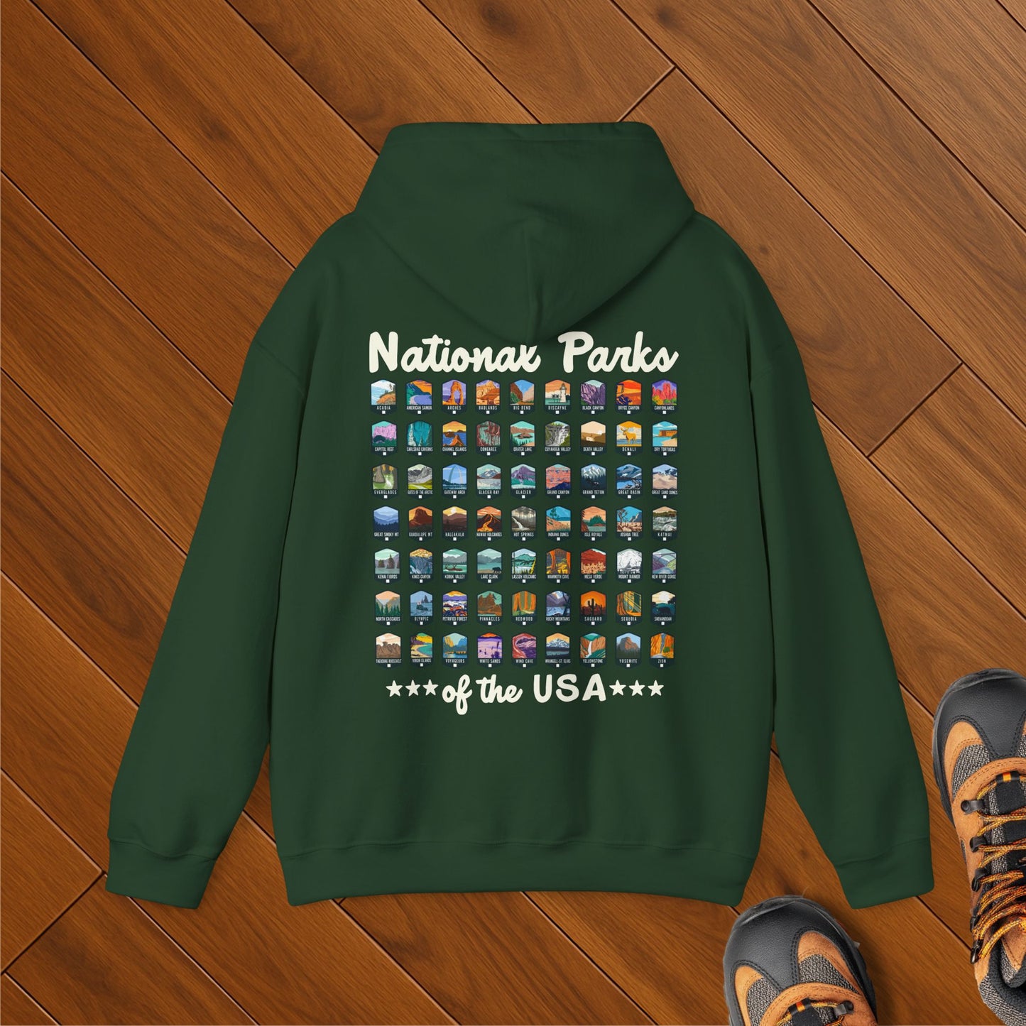 Forest green hoodie with colorful icons of all 63 U.S. national parks and “National Parks of the USA” text in bold retro script