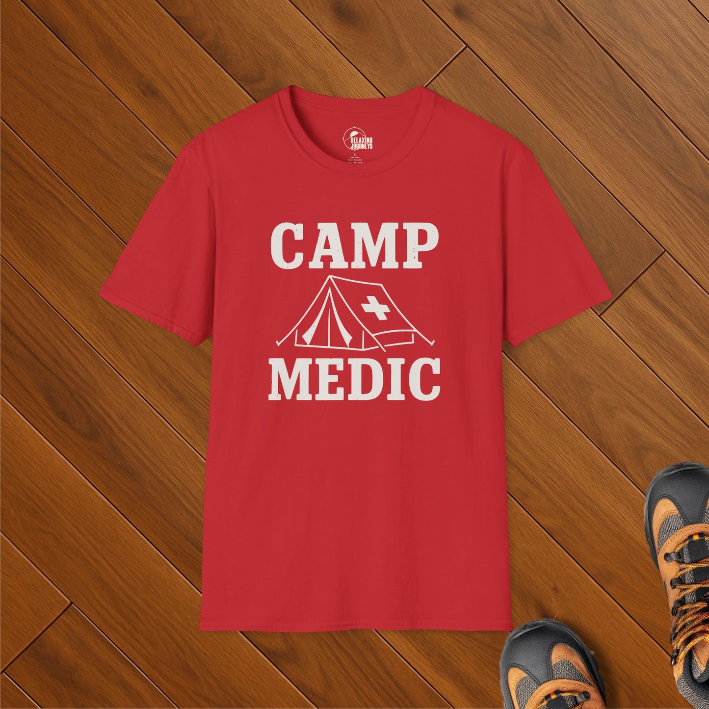 Red t-shirt with bold white text "Camp Medic" and graphic of a tent with a medical cross