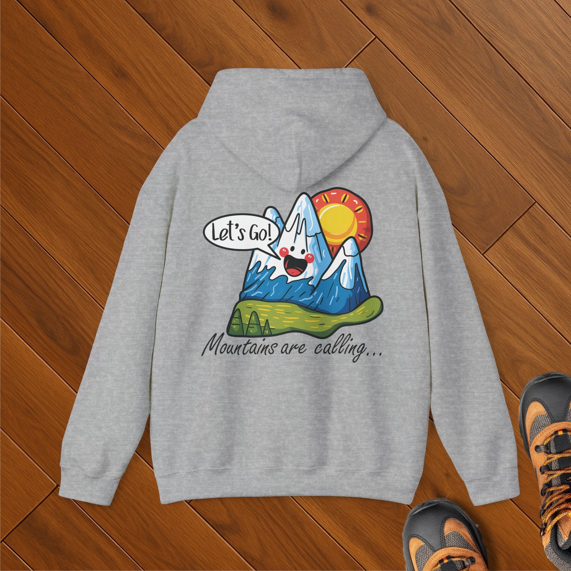 Gray hoodie with cartoon mountain saying “Let’s Go!” and sun in background; text reads “Mountains are calling…”