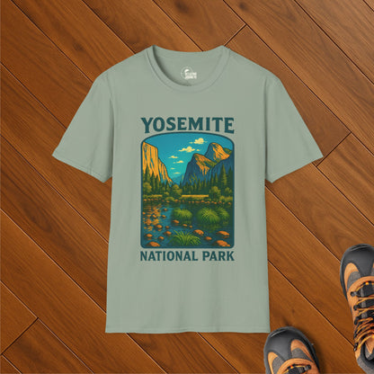Green t-shirt with colorful illustration of Yosemite National Park including Half Dome, El Capitan, and a scenic valley view with trees and a stream