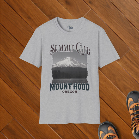 Heather gray t-shirt with Mount Hood Summit Club design, featuring a snowy peak and forest silhouette, styled on wood floor with hiking shoes