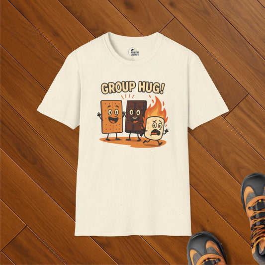 Cream t-shirt with cartoon s’mores characters—graham cracker, chocolate, and flaming marshmallow—group hugging with “Group Hug!” text