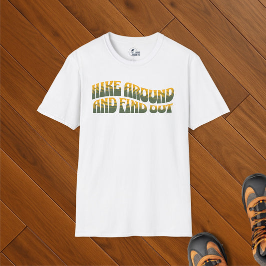 White t-shirt with bold retro-style text reading “Hike Around and Find Out” in green and yellow gradient
